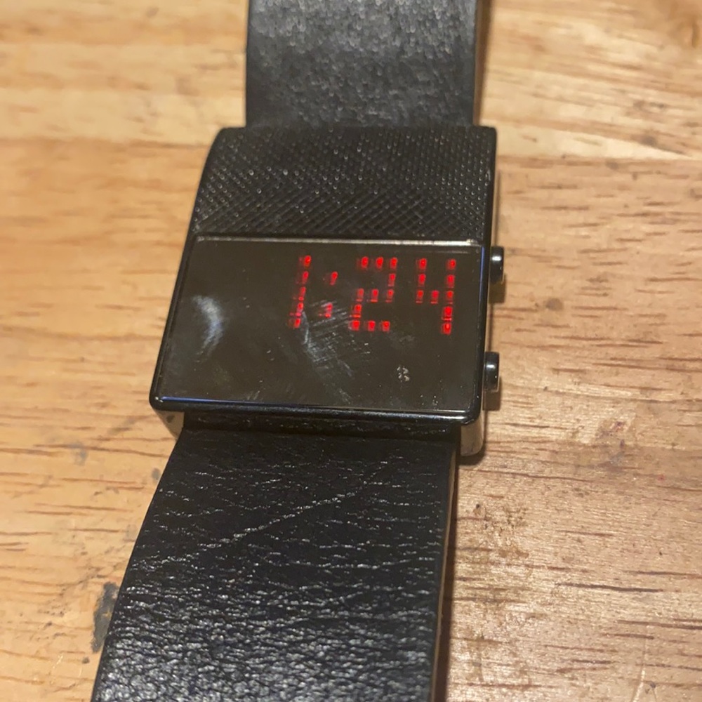 Black Dice digital watch.